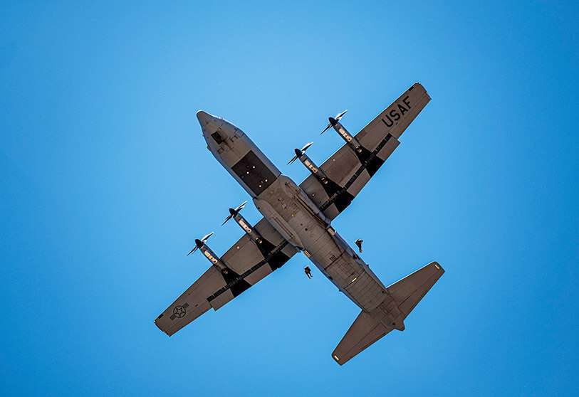 MARÍA SENOVILLA - Two Spanish paratroopers jump out of a US Hercules aircraft