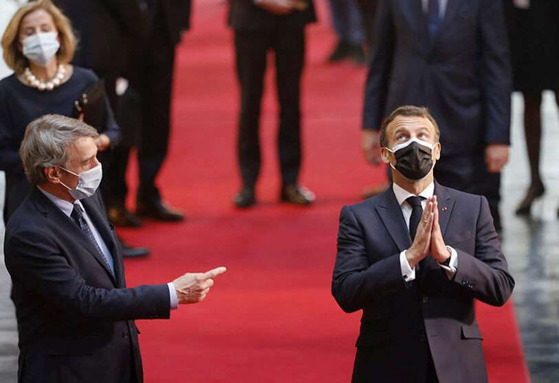 AP/JEAN-FRANCOIS BADIAS - French President Emmanuel Macron, right, and European Parliament President David Sassoli, arrive at the European Parliament in Strasbourg, eastern France, Sunday, May 9, 2021.