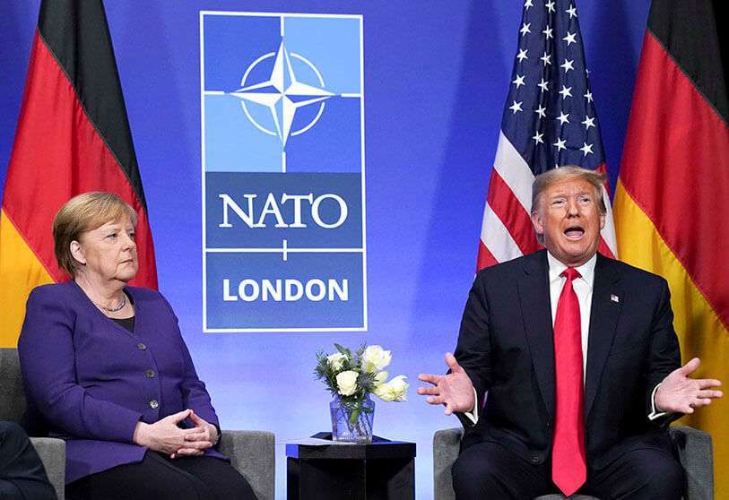 El presidente de Estados Unidos, Donald Trump, habla durante una reunión bilateral con la canciller alemana Angela Merkel al margen de la cumbre de la OTAN en Watford