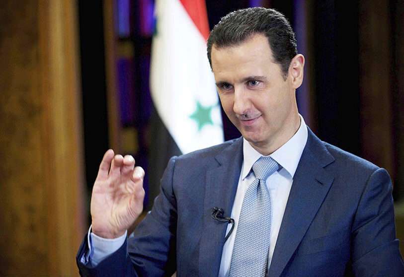 En esta foto de archivo del 10 de febrero de 2015, publicada por la agencia oficial de noticias siria SANA, el presidente sirio Bachar al-Asad durante una entrevista en Damasco, Siria