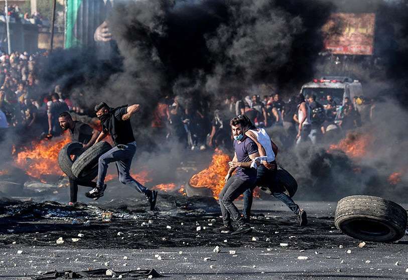 Los palestinos de toda Cisjordania y del este de Jerusalén y de los distritos árabes de Israel se adhirieron hoy en gran medida a una huelga general en protesta contra la ocupación israelí y en apoyo de los habitantes de Gaza AFP/ JAAFAR ASHTIYEH