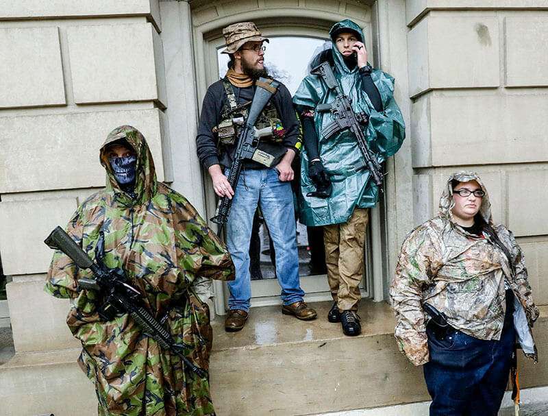 AFP/JEFF KOWALSKY - Armed demonstrators protest in Lansing, Michigan, on May 14, 2020.