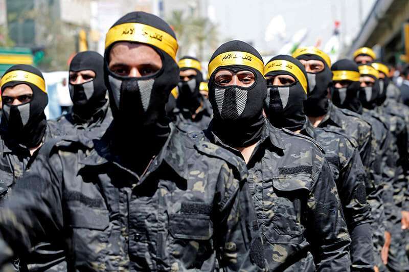Chiíes iraquíes marchan durante un desfile que marca el Día de Al-Quds (Día de Jerusalén), en Bagdad, Irak